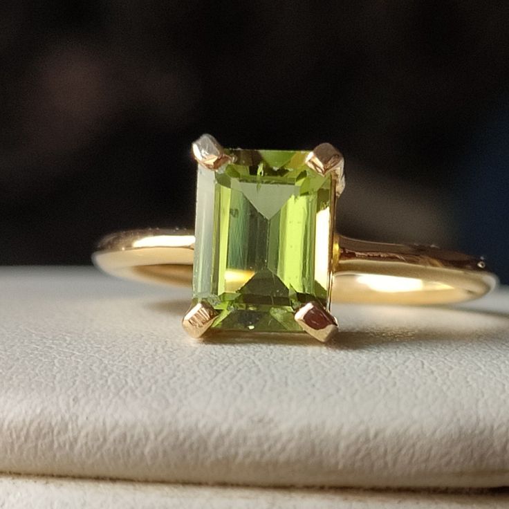 Material  14k Yellow Gold  . Gemstone  Natural Peridot  . Gemstone Colour  Green  . Gemstone Shape  Cushion  . Gemstone Size  6x8 MM . birthstone  August  . Cut Grade  Excellent . Style  Art Deco Classic Wedding Gemstones With Diamond Cut, Elegant Peridot Birthstone Ring With Prong Setting, Formal Peridot Diamond Ring In Yellow Gold, Yellow Gold Radiant Cut Ring For May Birthstone, Wedding Yellow Gold Solitaire Emerald Ring, Yellow Gold Radiant Cut May Birthstone Ring, Yellow Gold Radiant Cut Emerald Ring For Wedding, Yellow Gold Radiant Cut Emerald Wedding Ring, Gold Emerald-cut Gemstones With Accent Stones