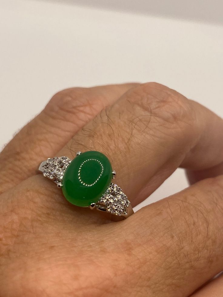 Vintage Lucky Green Nephrite Jade Ring https://www.etsy.com/listing/1073234687/vintage-lucky-green-nephrite-jade-ring Fine Jewelry Green Oval Cabochon Rings, Oval Green Jewelry With Polished Finish, Green Emerald Oval Cabochon Ring, Fine Jewelry Green Oval Cabochon, Green Oval Opal Ring With Polished Finish, Green Oval Cabochon Ring With Center Stone, Jade Rings With Polished Finish, Oval Cabochon, Green Cabochon Fine Jewelry Rings, Jade Rings With Polished Finish In Oval Cabochon Shape