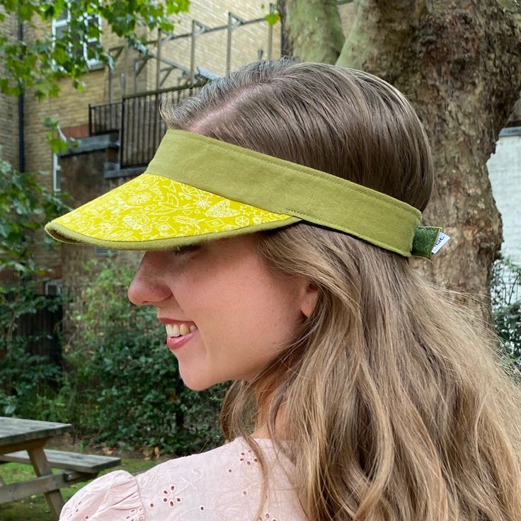 Boo That have reimagined the sun visor into fashionable, luxurious statement headwear. They are lightweight and soft to wear and to handle.  Visors are made one at a time, by hand, in my London millinery studio in a range of carefully curated fabrics.  Size Medium fits approximately 53-59cm head size. Chartreuse yellow graphic print with contrast sage green linen. They were developed originally for a customer who wanted something prettier than a sports visor to protect her skin when she was havi Lightweight Adjustable Fit Hat For Spring, Summer Hats With Uv Protection And Adjustable Fit, Adjustable Curved Brim Hat For Summer, Adjustable Sun Hat With Upf 50+ For Spring, Adjustable Fit Sun Hat With Upf 50+ For Spring, Adjustable Lightweight Sun Hat For Spring, Brimmed Summer Outdoor Visor, Adjustable Sun Hat With Uv Protection, Summer Outdoor Brimmed Visor