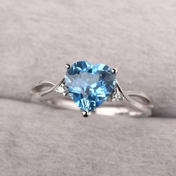 ◆ The ring is handcrafted from sterling silver and decorated with a dazzling 8*8 mm Swiss blue topaz and CZs. It is suitable for engagement/anniversary/daily occasion. ◆ Production Description: Main stone Type: Swiss blue topaz Main Stone Shape: Heart Cut Main Stone Size: 8*8 mm(2.34ct) Side stone: CZ Metal: 925 Sterling silver - Other options available in the drop down menu ◆ Customization: √Free for Add Engraving √Other Metal Type Available √Other Gemstones & Shapes Available √Personalization November Birthstone Engagement Ring, Pastel Blue Rings, Sky Blue Rings, Silver Ring Blue Stone, Engagement Rings Silver Blue, Heart-shaped Birthstone Ring With Diamond Accents For Wedding, Light Blue Topaz Ring With Brilliant Cut For Wedding, Light Blue Sapphire Ring For Anniversary, Light Blue Topaz Wedding Ring With Brilliant Cut