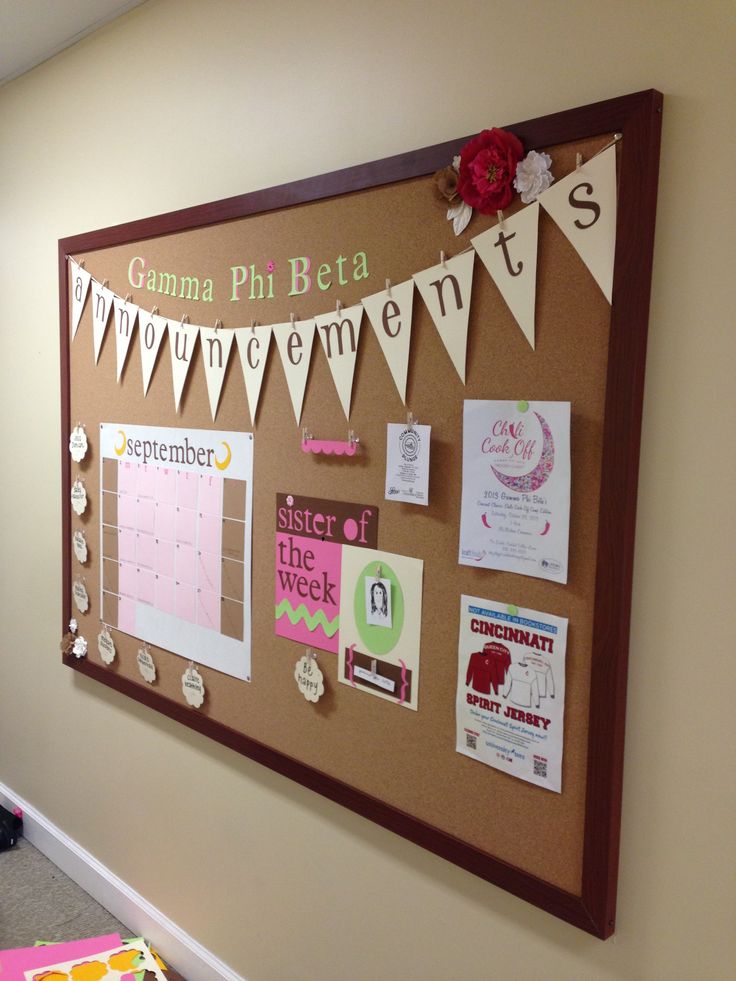 the bulletin board is decorated with papers and magnets