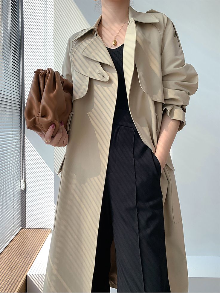 This belted midi-length trench coat is an elegant and sophisticated wardrobe staple for the modern woman. With a stylish gun flap, flap pockets, and true-to-size fit, it's a timeless classic that can be dressed up or down for a variety of occasions. Long sleeves with belted cuffs Notched lapels Flap pockets Lined Cotton, polyester Machine wash, tumble dry Women's trench coat Item #310312 Size info XS=US2=UK6=EU32 S=US4-6=UK8-10=EU34-36 M=US8-10=UK12-14=EU38-40 ★★ It would be helpful if you provi Beige Belted Outerwear For Business Casual, Spring Business Outerwear With Belted Cuffs, Belted Outerwear For Office In Solid Color, Modern Belted Spring Outerwear, Chic Double-breasted Outerwear With Flap Pockets, Spring Office Outerwear With Belt, Chic Outerwear With Flap Pockets For Office, Chic Office Outerwear With Flap Pockets, Elegant Long Khaki Outerwear