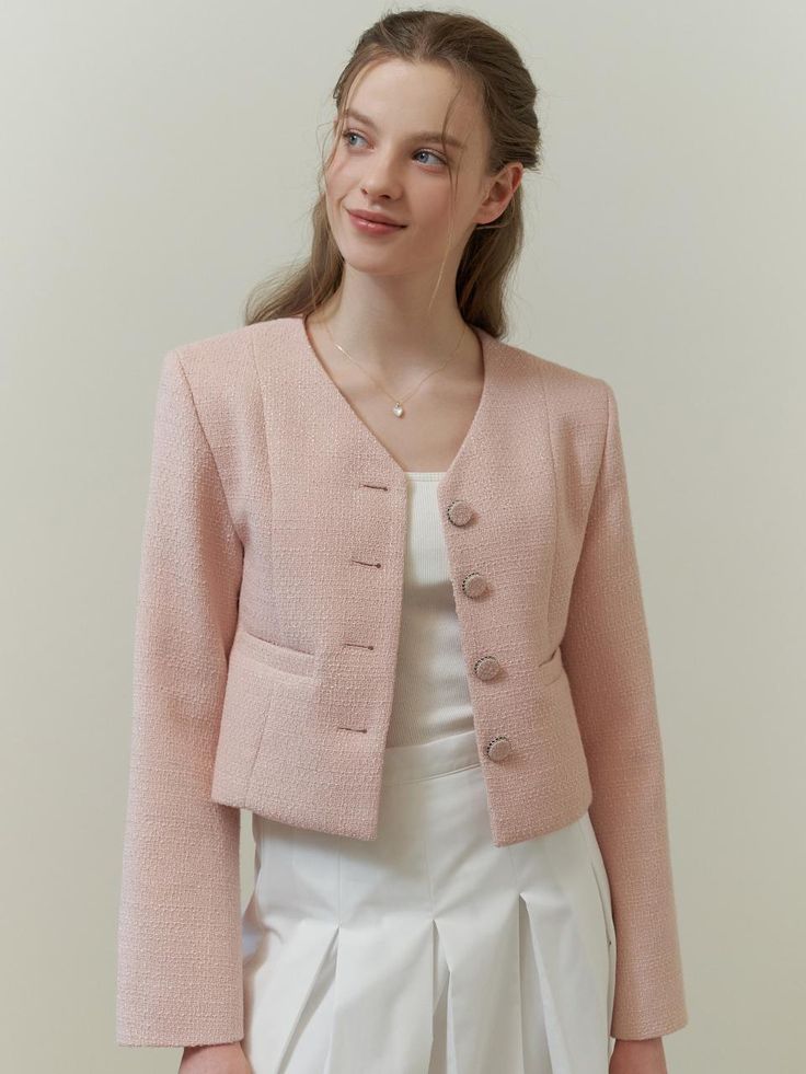 This piece of clothing is a textured jacket featuring a notched lapel and a three-button closure. This piece of clothing is a textured jacket featuring a notched lapel and a three-button closure. It is tailored with a structured fit and includes two patch pockets on the front. The sleeves are full-length, and the overall design exudes a formal yet contemporary aesthetic.- The jacket presents a sophisticated appearance with its notched lapels and button details.- Patch pockets add both function and a casual touch to the otherwise formal item.- Its textured fabric contributes to a rich, tactile experience and visual depth. Chic Tweed Jacket With Notch Lapel, Chic Single Breasted Tweed Jacket With Lapel Collar, Chic Tweed Blazer With Button Closure, Chic Single-breasted Tweed Jacket With Lapel Collar, Chic Semi-formal Tweed Jacket With Notch Lapel, Spring Formal Double-breasted Tweed Jacket, Double-breasted Tweed Blazer With Button Closure, Spring Long Sleeve Tweed Jacket With Single Button, Semi-formal Spring Tweed Jacket With Pockets