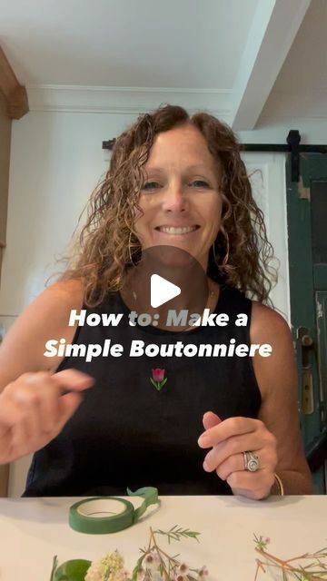 a woman sitting at a table with flowers on it and the words how to make a simple boutonniere