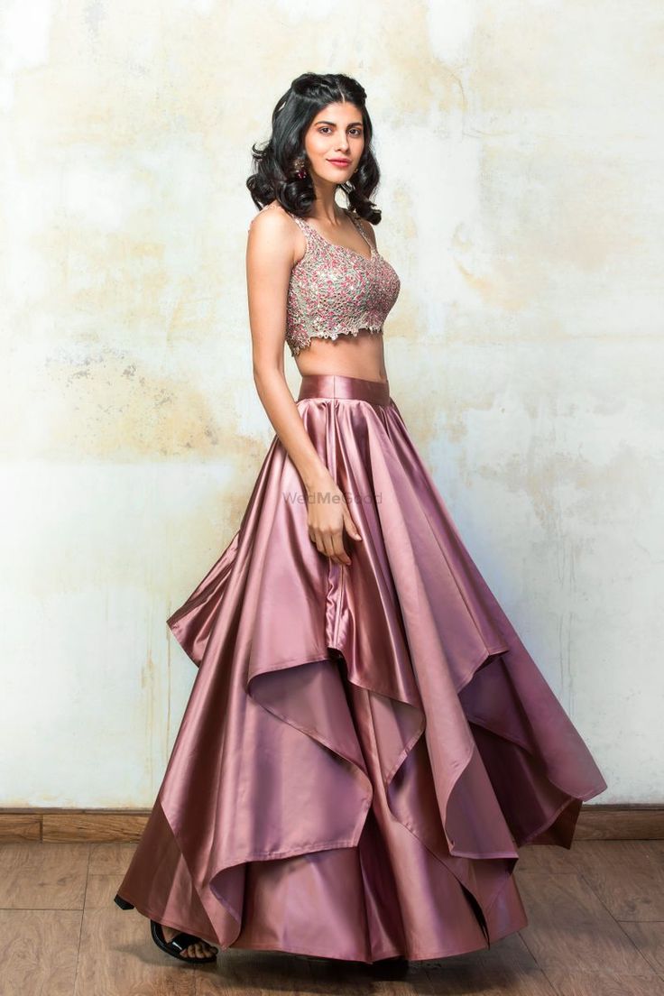 Rose pink satin layered lehenga by Izzumi Mehta Satin Lehenga Party Wear, Satin Dresses Indian Wear, Satin Layered Dress, Satin Dresses Traditional, Layered Lehenga Indian Outfits, Lehanga Designs Satin, Pink Satin Lehenga, Satin Traditional Outfit, Satin Skirt Outfit Indian