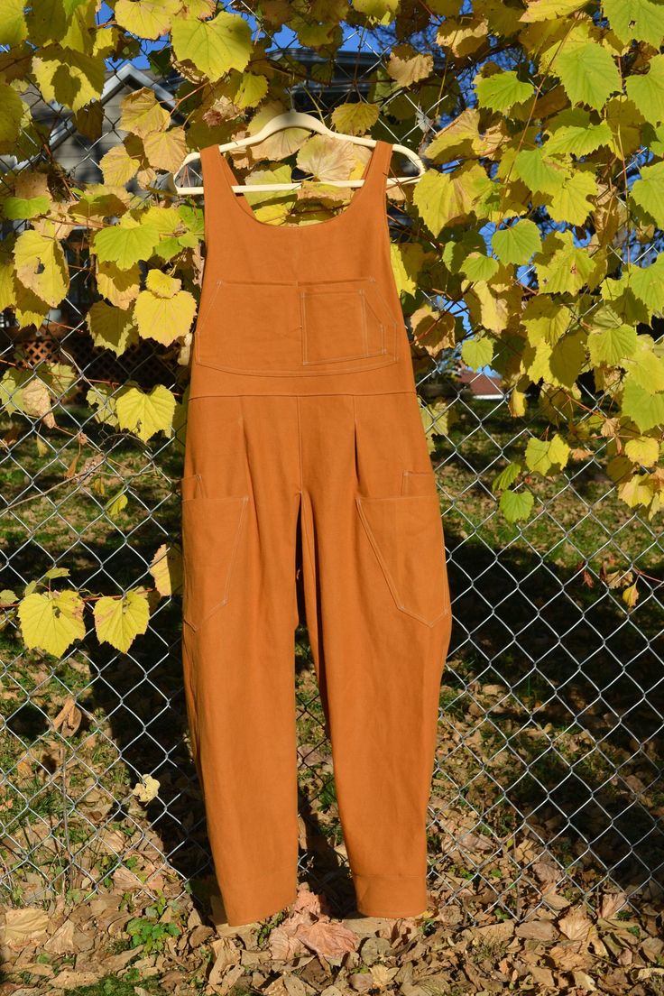 Meet the most comfortable and versatile overalls! Designed with practicality in mind, these overalls will not hinder your movement, no matter what you get up to. Wear them in the garden, out to your favorite coffee shop, or on a hike in the woods. They move and stretch with you, leaving room for long strides and deep squats.  Take advantage of the standard quad pockets for the ultimate hands-free clothing option, add on front pockets, or customize pockets to your needs!  Overalls are made to a s Brown Utility Overalls For Fall, Outdoor Bib Front Overalls With Pockets, Casual Jumpsuits And Rompers With Pockets For Outdoor, Utility Jumpsuits And Rompers With Pockets For Outdoor, Brown Relaxed Fit Overall Jumpsuit, Brown Relaxed Fit Jumpsuit Overall, Brown Relaxed Fit Jumpsuit, Brown Relaxed Fit Overalls, Utility Overalls With Side Pockets For Fall