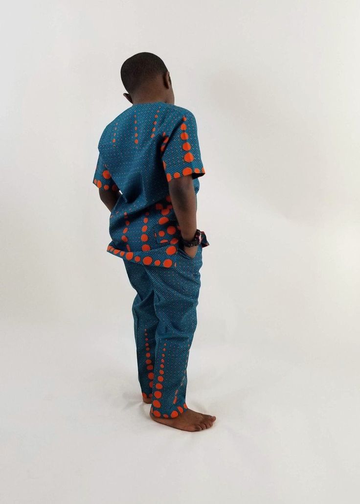 Boys African Traditional outfit. Add to your child's wardrop our boys Eva African - print ,made with 100% cotton poplin Ankara -African wax. Vibrant and stylish. Features of this Boys African clothing Short sleeve buttoned chest waist rubber band 2 side pockets Big fashion , little prices. Care Instruction: HAND WASH COLD. MILD DETERGENT. DO NOT BLEACH. HANG TO DRY. Casual Patterned Cotton Sets, Green Cotton Sets With Buttons, Green Short Sleeve Sets With Buttons, Orange Printed Cotton Set, Patterned Cotton Short Sleeve Sets, Patterned Cotton Sets With Short Sleeves, Outfit Short, Traditional Outfit, Big Fashion