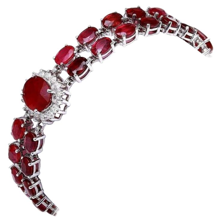 Very Impressive 23.30 Carats Natural Red Ruby & Diamond 14K Solid White Gold Bracelet STAMPED: 14K Total Natural Round Diamonds Weight: 1.30Carats (color G-H / Clarity VS2-SI1) Total Natural Rubies Weight is: 22.00 carats (Glass Filled) Bracelet length is: 7 inches Bracelet Width: 14.90mm (widest part) Bracelet total weight: 20.00g Disclaimer: all weights, measurements and colors are approximate and may vary slightly from the listed dimensions or as seen in the image. All pictures are magnified to show the smallest of details. Please, refer to the item description for actual weight and size evaluation. SKU #TF73 White Gold Bracelet, Ruby Diamond, Red Ruby, Natural Ruby, Natural Red, Pandora Charm Bracelet, Anklets, Diamond Bracelet, Round Diamonds