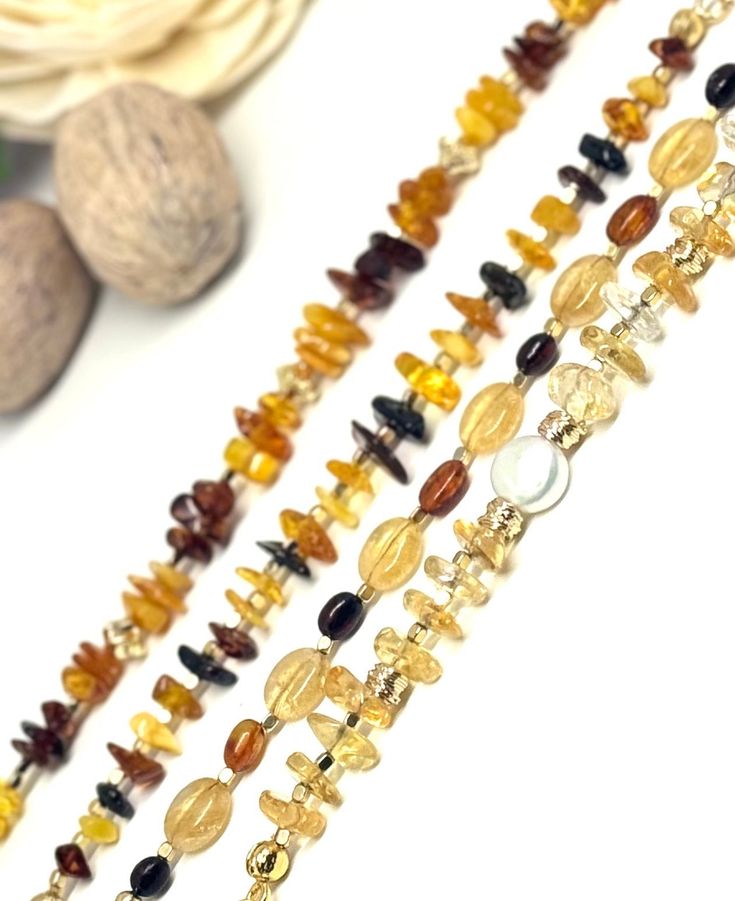 Gold-plated Citrine and Baltic Amber bracelets are ready for the Spring. Each gorgeous citrine and Baltic amber gemstones are carefully selected to bring a pop of golden sunshine to your wrist. Not only does it add a touch of glamour to any outfit, but citrine is also believed to sweep away negativity and usher in positivity and abundance.  Gemstone attributes:  Citrine is associated with wealth, good luck, and personal growth and is believed to attract prosperity.  Baltic amber is believed to o Amber Gemstone Beaded Bracelets As Gift, Amber Gemstone Beaded Bracelet As Gift, Handmade Adjustable Baltic Amber Jewelry, Amber Gemstone Beads Crystal Bracelet As Gift, Amber Crystal Bracelet With Gemstone Beads As Gift, Adjustable Gold Crystal Bracelet With Natural Stones, Amber Round Bracelets As Gifts, Amber Round Bracelets As A Gift, Round Amber Bracelet As Gift