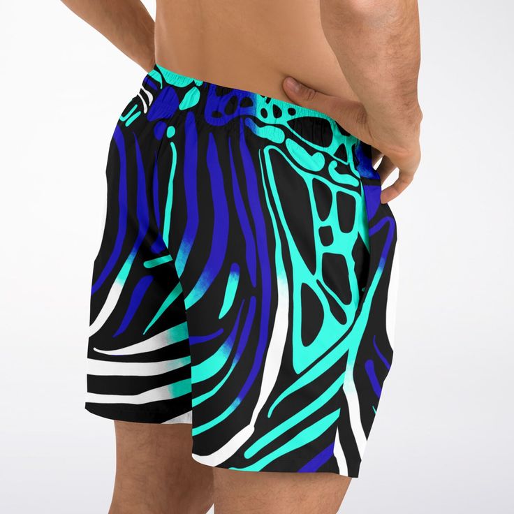 Dive into summer with confidence and style in our Maris Equi Men's Angelfish Swim Shorts. Crafted for both comfort and performance, these swim trunks are the perfect companion for your beach adventures. Pair them with our matching shirts, flip flops, and swim briefs for a coordinated look that's sure to turn heads. Explore our collection now and make a splash this season! These swim trunks are handmade after you order them. Please allow 2 weeks for delivery. This suit has a lot of stretch and is Relaxed Fit Swimwear With Built-in Shorts For Surfing, Relaxed Fit Swim Trunks With Built-in Shorts, Vacation Swim Trunks For Surfing, Beachwear Shorts For Water Sports During Beach Season, Green Swim Trunks With Upf 50+ For Vacation, Short Swim Trunks For Beach Season Water Sports, Summer Swim Trunks For Water Sports, Blue Beachwear Athletic Shorts For Summer, Summer Beachwear Shorts For Water Sports