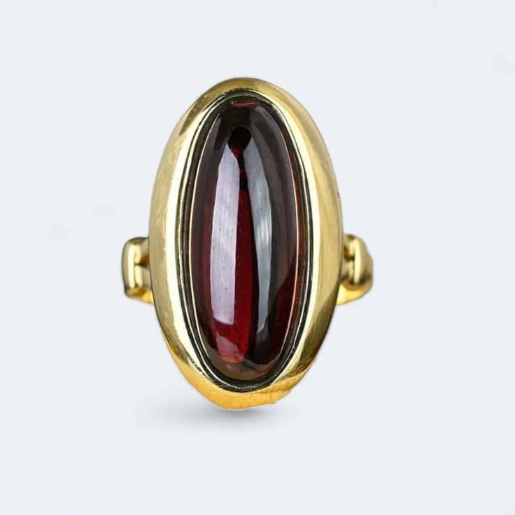 Introducing our exquisite Victorian Garnet Ring crafted in 9k yellow  gold weighing 5.8 grams. Adorned with a natural 4.5 ctw Garnet, this beautifully decorated ring is a perfect choice for an anniversary, engagement, or wedding. The radiant yellow finish adds a touch of warmth and sophistication, making it a timeless piece for her collection. Elevate your style with this unique and meticulously crafted ring, a celebration of love and elegance. Formal Yellow Gold Cabochon Sapphire Ring, Heirloom Gemstone Dome Ring For Formal Occasions, Formal Heirloom Gemstone Dome Ring, Formal Heirloom Dome Ring With Gemstone, Formal Cabochon Ruby Ring, Elegant Domed Sapphire Ring For Formal Events, Elegant Garnet Ruby Ring Stamped 14k, Elegant Yellow Gold Oval Cabochon Signet Ring, Gold Oval Cabochon Sapphire Ring For Formal Occasions