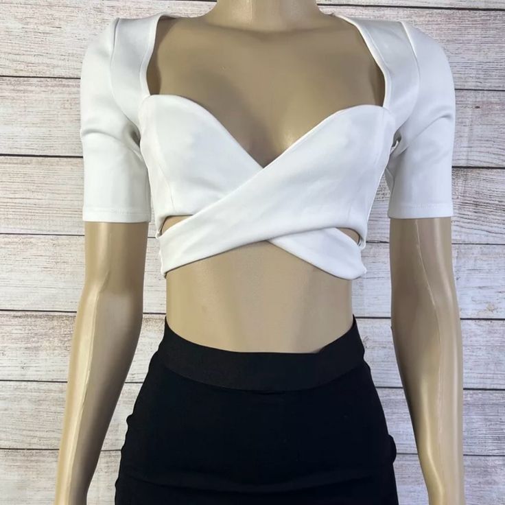 Elevate Your Wardrobe With This Stunning Ivory Crop Top From Tobi. Perfect For Any Occasion, It Features A Sweetheart Neckline, Short Sleeves, And A Casual Sleeve Style. The Pullover Closure Ensures A Comfortable Fit, While The Breathable Polyester Material Makes It Perfect For All Seasons. Accessorized With A Strap Accent And A Solid Pattern, This Limited Edition Crop Top Is A Regular Fit And Is Available In Size Xs. Hand Wash Only, This Bohemian Style Top Is Ideal For Both Party/Cocktail And C Chic White V-neck Crop Top, White Stretch Tops For Night Out, White Fitted Top For Party, White Fitted Top For Night Out, Fitted White Party Top, White Fitted Crop Top For Party, Chic White Short Sleeve Crop Top, White Fitted Crop Top, White Fitted Chic Crop Top