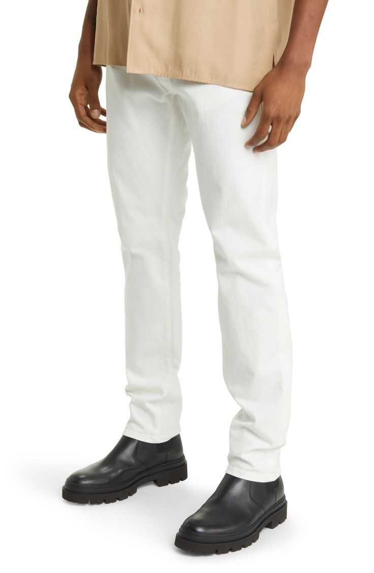 Soft stretch denim refreshes the look and feel of all-occasion jeans cut with a classic mid-rise and modern slim fit that still gives you room to move. 32" inseam; 13" leg opening; 9" front rise; 13" back rise (size 29) Zip fly with button closure Five-pocket style 93% organic cotton, 5% elasterell-p, 2% elastane Dry clean or machine wash, tumble dry Made in the USA of imported fabric Men's Clothing Fitted Straight Jeans For Spring, Classic White Straight Fit Jeans, Slim Fit Straight Bottoms For Spring, Straight Silhouette Cotton Bottoms With Five Pockets, Spring Slim Fit Straight Bottoms, Cotton Bottoms With Five Pockets In Straight Silhouette, Straight Fit Cotton Bottoms With Straight Silhouette, Classic Straight Silhouette Jeans For Spring, Classic Straight Jeans For Spring