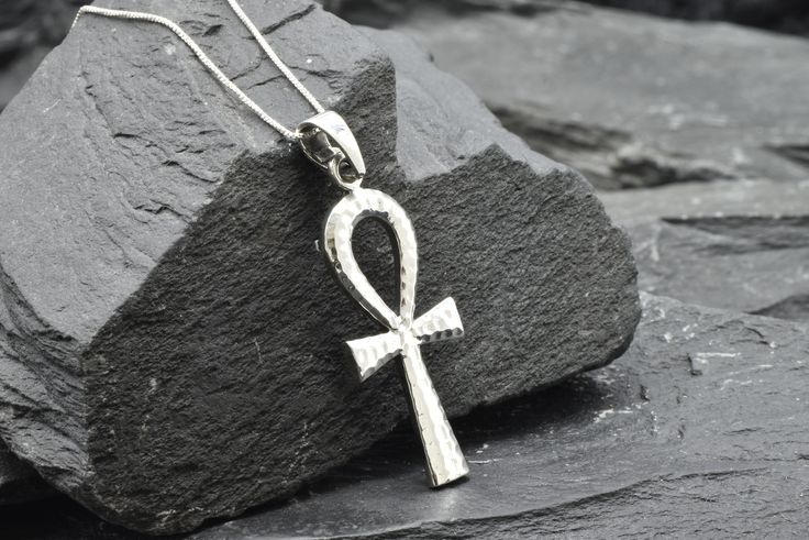 Ankh Cross Pendant made of Solid 925 Sterling Silver ☞ made to last.Matching Ring & Earrings - please ask meDetails:• Hammered Cross Pendant• Dimensions: Pendant Height 36mm, Width 17mm• Free Complimentary Chain• Solid 925 Sterling SilverSKU P-01302 Symbolic 925 Silver Jewelry Gift, Symbolic Gemstone Jewelry For Formal Occasions, Sterling Silver Cross Fine Jewelry, Symbolic Nickel-free Jewelry For Anniversary, Unique Sterling Silver Cross Necklace, Fine Jewelry Sterling Silver Cross, Elegant Nickel-free Cross Jewelry, Engraved Sterling Silver Dangle Jewelry, Symbolic Silver Dangle Jewelry