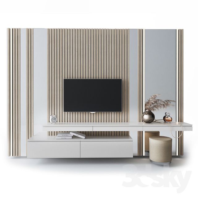 a white entertainment center with a flat screen tv mounted on it's side wall