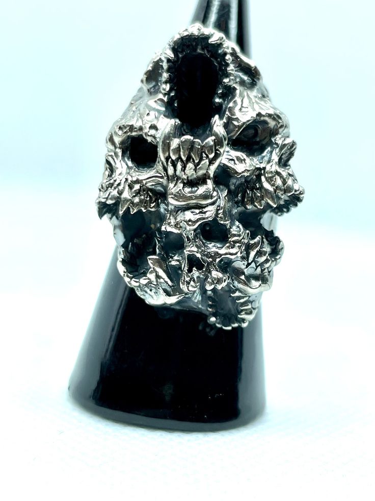 Jewel made entirely by hand by the Italian craftsman Gianmarco Fontana. Ring made of 925 Silver, which is part of the "SKULLS" collection depicting Paranoia. This ring represents the transformation and progression of Paranoia. Psychosis characterized by the development of a chronic, coherent delusion, which evolves slowly, leaving the remaining psychic functions intact. Luxury Silver Skull Ring For Formal Occasions, Unique Silver Skull Ring Collectible, Handmade Silver Skull Ring, Symbolic Style, Spiritual Silver Engraved Skull Ring, Handmade Silver Symbolic Skull Ring, Handmade Symbolic Silver Skull Ring, Silver Skull Ring Hand Cast For Anniversary, Handmade Silver Skull Ring, Unique Silver Skull Ring Hallmarked