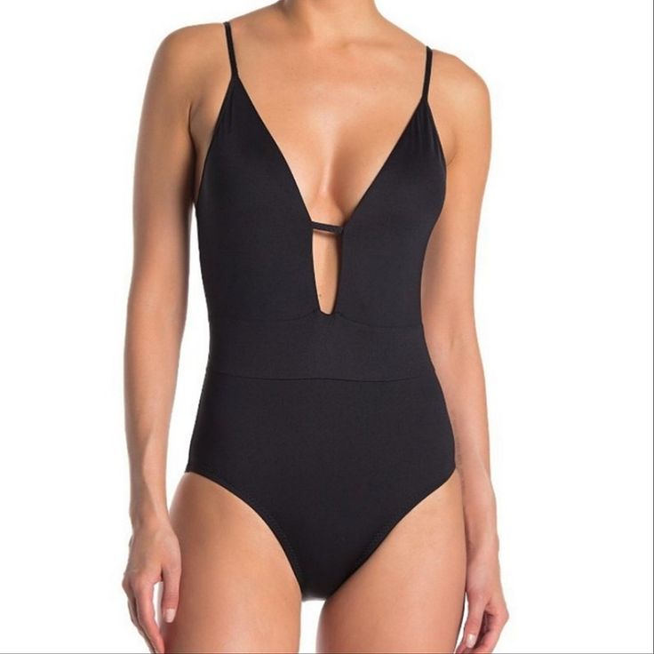 Becca By Rebecca Virtue Black One Piece Swimsuit A Plunging V Neckline Adjustable Straps Strappy Tie Back Closure Slimming Banded Waistline Removable Cups Moderate Coverage Lined New Condition, Boutique Item May Or May Not Have Paper Price Tag Cut To Prevent Retail Returns Size Small Rebecca Virtue Becca Color Code Black Plunging One Piece Swim Chic V-neck Swimwear With Lined Body, Chic V-neck Lined Swimwear, Chic One-piece Swimwear For Night Out, Chic V-neck Bodysuit For Pool, Chic V-neck One Piece For Pool, Summer V-neck Bodysuit For Night Out, Chic Low-cut Swimwear For Pool, Chic Low-cut Swimwear For Swimming, Fitted V-neck Cutout Bodysuit