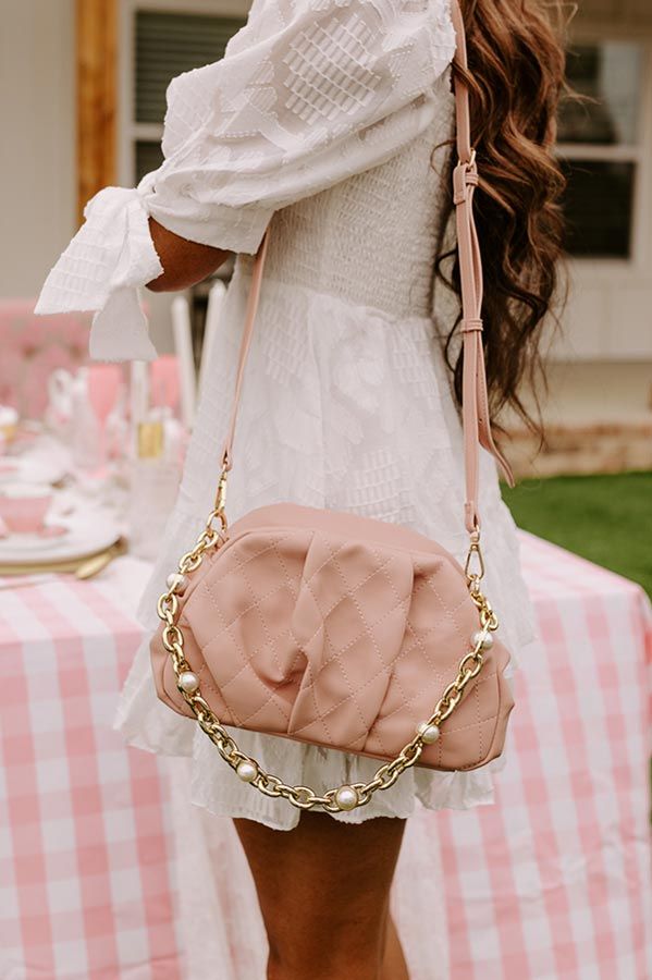 - Upgrade your look with this trendy purse! - Quilted faux leather material in a blush hue - Pleated detail - A spacious rectangular pouch with an interior zippered pocket - Zip and magnet closure - Gold hardware - A detachable chunky chain strap with faux pearl accents as well as a detachable faux leather shoulder strap with adjustable length Chic Blush Shoulder Bag For Travel, Chic Pink Clutch With Zipper Closure, Blush Rectangular Shoulder Bag With Zipper, Trendy Pink Clutch With Zipper Closure, Trendy Pink Clutch With Zipper, Chic Blush Clutch For Evening, Chic Blush Bag With Detachable Strap, Chic Blush Bags For Everyday Use, Chic Pink Clutch With Chain Strap