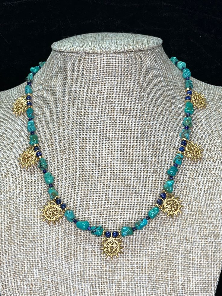 "Ancient style Turquoise and Lapis Hittite Sun pendant necklace!  Beautiful 22k gold plated Hittite Sun pendants to compliment ancient Roman, Greek, Parthian, Coptic, Celtic, Persian or any other historic persona and you can wear them with your favorite T shirt!  These necklaces are finished with 14k gold filled lobster clasps but can be converted to more historically appropriate closures at no extra charge. Want a necklace like this with different stones and/or earrings to go with?  Convo me!  I love making custom orders! All necklaces are 18\" to 19\" long, custom lengths are available upon request." Spiritual Gold Turquoise Necklace With Gemstone Beads, Gold Turquoise Necklace With Gemstone Beads For Spiritual Style, Bohemian Gold Emerald Necklace With Gemstone Beads, Gold Turquoise Gemstone Beads Bohemian Necklace, Artisan Turquoise Necklace With Natural Stones In Gold, Bohemian Gold Turquoise Necklace With Gemstone Beads, Gold Bohemian Turquoise Necklace With Gemstone Beads, Artisan Gold Turquoise Necklace With Natural Stones, Bohemian Gold Turquoise Necklace With Natural Stones