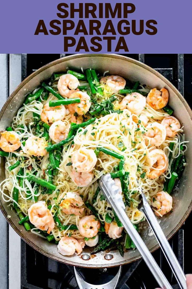 shrimp and asparagus pasta in a skillet with chopsticks