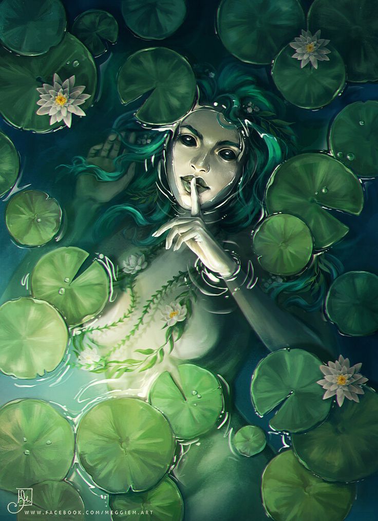 a woman is floating in the water surrounded by lily pads