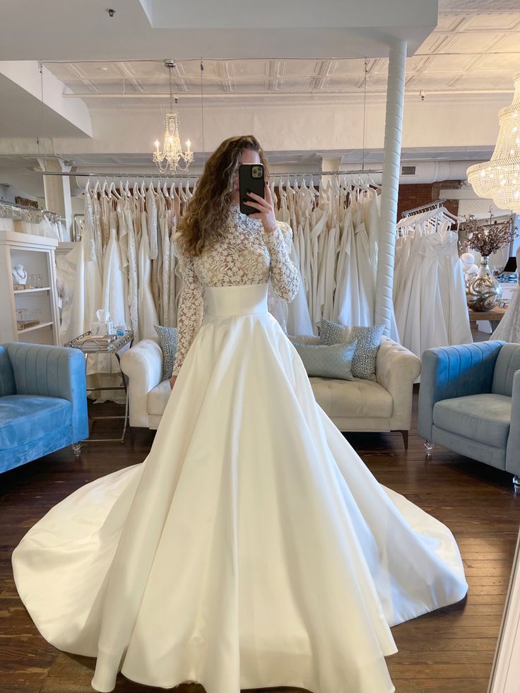 a woman taking a selfie in her wedding dress