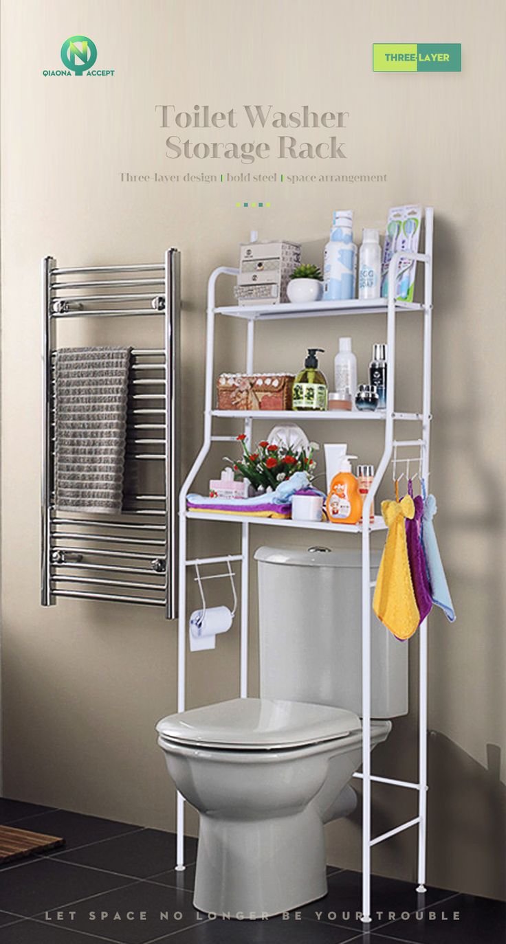 a white toilet sitting in a bathroom next to a rack with towels and other items