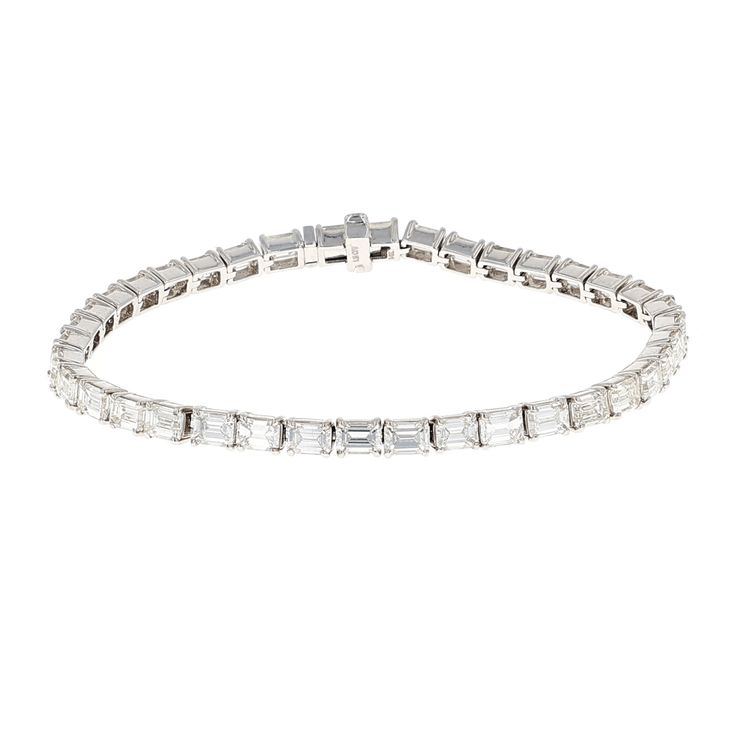 This IDC Signature Collection is as elegant as it is opulent. Taking a timeless classic, Emerald Cut Diamonds, and placing them in a East West orientation, gives this tennis bracelet a contemporary aesthetic. With 9.52 CTW, each Diamond is set in a four prong 14k White Gold setting to further allow the brilliance of the diamonds to sparkle. Color/Clarity: HI/VS White Gold Set, Diamond Tennis Bracelet, Emerald Cut Diamond, Tennis Bracelet Diamond, Contemporary Aesthetic, Emerald Cut Diamonds, East West, Signature Collection, Tennis Bracelet