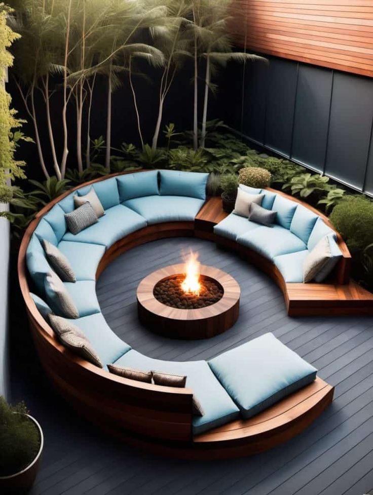 an outdoor fire pit with seating around it