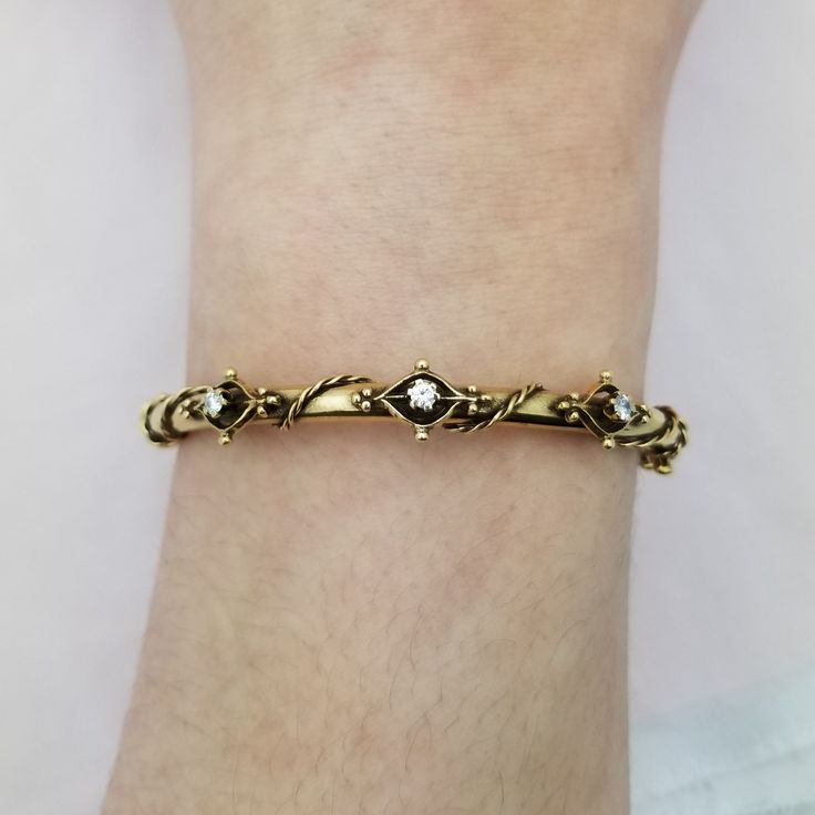 Absolutely stunning, very old bracelet of 14K yellow gold and three diamonds.  This piece has so many exquisite details! It has a twisted rope and filigree design. Diamonds are 2.5mm round each and the three of them total .18TCW - 2.5" diameter - Safety clasp - 9.87g Antique Gold Bracelet With Intricate Design For Anniversary, Antique Diamond Accented Bracelets For Anniversary, Classic Diamond Bracelet With Intricate Design For Gift, Classic Diamond Bracelet With Intricate Design As Gift, Diamond Bracelets With Intricate Design In Yellow Gold, Yellow Gold Diamond Bracelets With Intricate Design, Vintage Diamond Bracelet With Diamond Accents, Vintage Diamond Bracelet With Diamond Accents As Gift, Yellow Gold Diamond Bracelet With Intricate Design