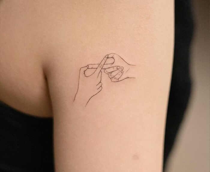 a woman with a small tattoo on her arm