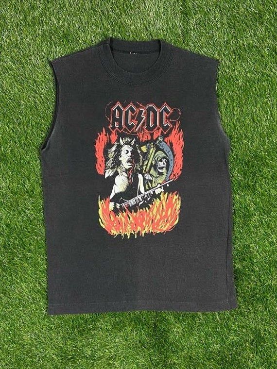 Vintage AC DC T Shirt Great Vintage Condition No Tag Each Vintage item is unique and fits differently. Please refer to measurements for the best fit. Size Medium Width 19 3/4 in Length 26 1/4 in * I ship all items in two to three business days and utilize Priority Mail options via USPS. Expedited shipping is available upon request. If you have any questions; Please Ask! * All of my items are pre-owned and, unfortunately, sometimes have scuffs, stains, or other signs of pre-lovin'. I will always Cotton Grunge Tops For Music Festivals, Band Logo Tops For Alternative Fashion With Crew Neck, Grunge Tops With Screen Print For Music Festivals, Punk Style Cotton Tops For Festival, Punk Cotton Tops For Music Festivals, Punk Style Cotton Tops For Music Festivals, Punk Style Cotton Festival Tops, 90s Relaxed Fit Top With Band Logo, Grunge Muscle Tee With Crew Neck For Streetwear