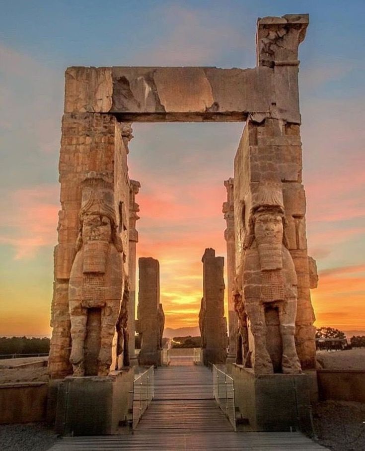 the entrance to an ancient temple at sunset