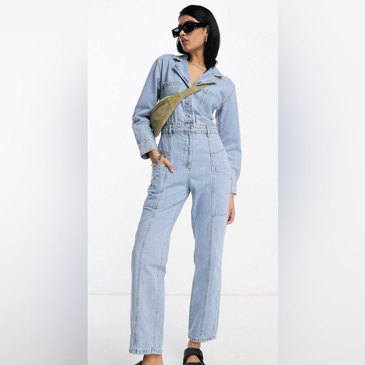 Never Worn. Soft Cotton Denim Boilersuit. Tags Still On. Straight Leg. Long Sleeve With Button Cuffs. Button Up Top And Waist. Zipper Pants Closure. Plenty Of Pockets On Chest, Back, And Sides. Cute For Any Season. Dress Up Or Dress Down. Not For Petite. Measurements Laying Flat: - Total Height (Shoulder To Ankle): 57 In. - Pit To Pit: 22 In. - Waist: 17.5 In. - Inseam: 28 In. Fitted Denim Jumpsuit With Button Closure, Long Sleeve Denim Jumpsuit With Buttons For Work, Utility Button-up Denim Jumpsuit, Medium Wash Jumpsuits And Rompers With Buttons For Work, Denim Blue Button-up Jumpsuit For Work, Denim Overalls With Buttons For Work, Light Wash Overall Jumpsuit For Work, Medium Wash Jumpsuits With Buttons For Workwear, Workwear High Rise Denim Jumpsuit With Button Closure