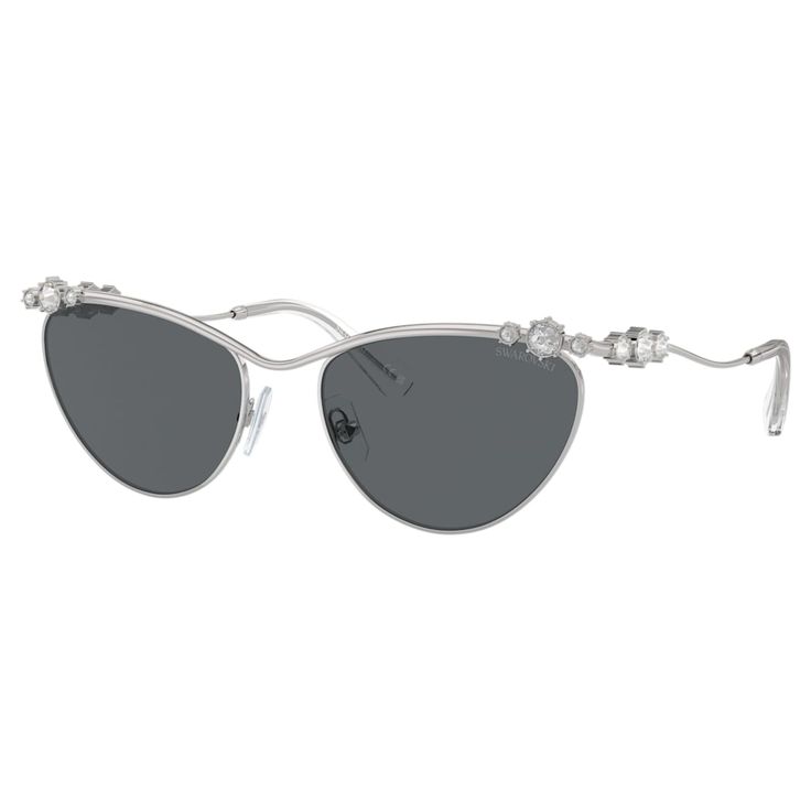 These eye-catching sunglasses are inspired by Swarovski’s Constella family and combine classic elegance with extraordinary shine. Prong-set clear crystals in a variety of sizes adorn curved silver-tone metal temples, while the dark gray lenses are placed in a semi-rim frame. A striking way to add a touch of glamour to your everyday look. Swarovski Sunglasses, Sunglasses Oval, Gradient Brown, Gray Lenses, Round Frames, Clear Crystals, Grey Lenses, Retro Chic, Classic Elegance