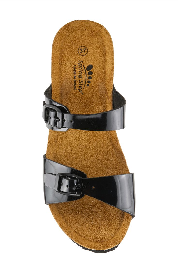 Adjustable straps add modern intrigue and a customized fit on a weekend-ready slide sandal lifted by a chunky platform and wedge heel. 1 3/4" heel Adjustable buckle straps Molded footbed Synthetic upper, lining and sole Made in Spain Modern Black Slides With Buckle Closure, Synthetic Wedge Heel Footbed Sandals With Buckle Closure, Black Slide Mules With Buckle Closure, Black Platform Slide Footbed Sandals, Black Wedge Heel Slides With Removable Insole, Synthetic Slide Wedge Sandals With Buckle Closure, Black Wedge Sandals With Buckle Closure, Synthetic Buckle Closure Slide Wedge Sandals, Black Toe Loop Sandals With Buckle Closure