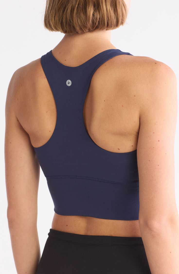 A soft and supportive sports bra features racerback straps and a longline silhouette. Scoop neck Racerback 83% polyester, 17% spandex Machine wash, tumble dry Imported Supportive Sports Bra, Supportive Sports Bras, Concert Looks, Tom Ford Sunglasses, Preppy Look, Flip Flop Slippers, Fitted Suit, Kids Outerwear, Ugg Classic