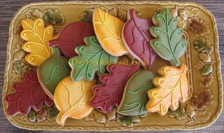 decorated cookies in the shape of autumn leaves