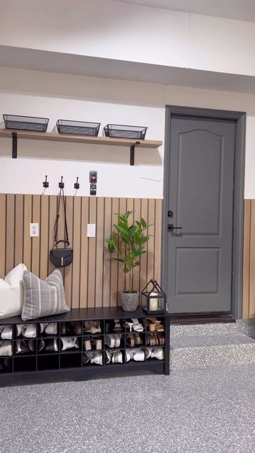 a living room filled with lots of furniture next to a wall mounted potted plant