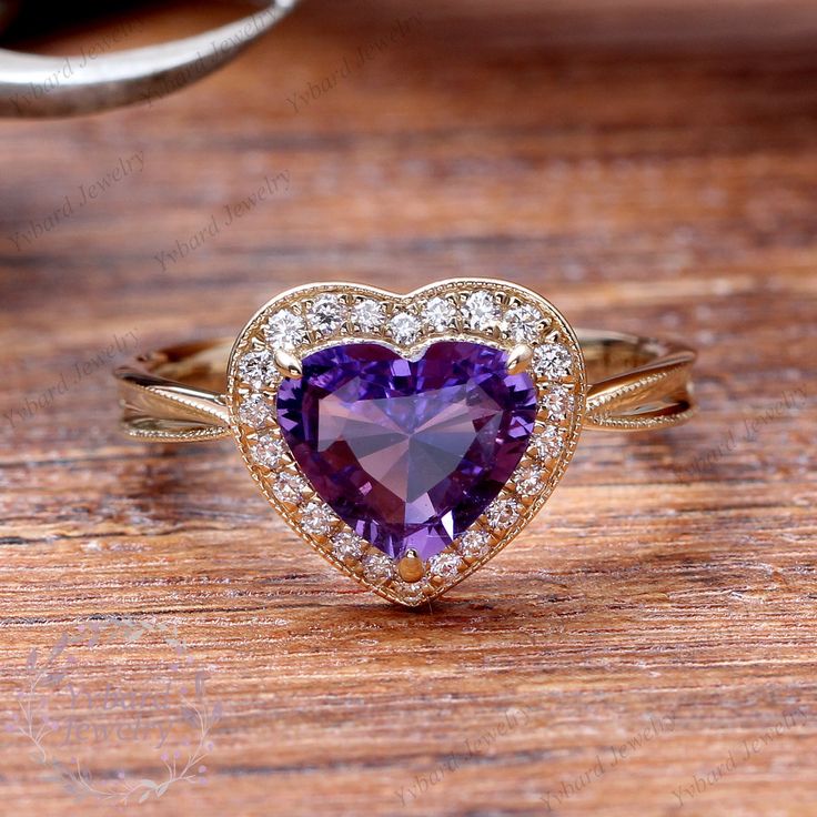 "(Please confirm your US size when you make an order) Jewelry Details -Gold Type : 14k gold Center Stone: NATURAL Amethyst 7mm, Approximately 1.5ct Color: 3A Clarity: VS Cut: Heart Cut / 3EX Side Stone: 0.14cttw diamond Color: G-H Clarity: SI1 Cut: Round Cut / 3EX Band Width: Approximately 2.1mm SKU: YR0072 ~*-*~Purchase Guarantee: - All our jewelry is handmade, and each process is refined. - 14 Day Refund Guarantee. - All our products are Free Shipping. - Free Gift Box&Packing. ~*-*~Please Elegant Amethyst Heart Cut Ring For Anniversary, Elegant Amethyst Heart Cut Ring For Wedding, Elegant Heart Cut Amethyst Ring For Anniversary, Elegant Purple Heart Cut Ring, Purple Heart Ring For Anniversary On Valentine's Day, Elegant Purple Heart Promise Ring, Valentine's Day Amethyst Heart Cut Ring, Valentine's Day Purple Amethyst Promise Ring, Valentine's Day Amethyst Heart Ring