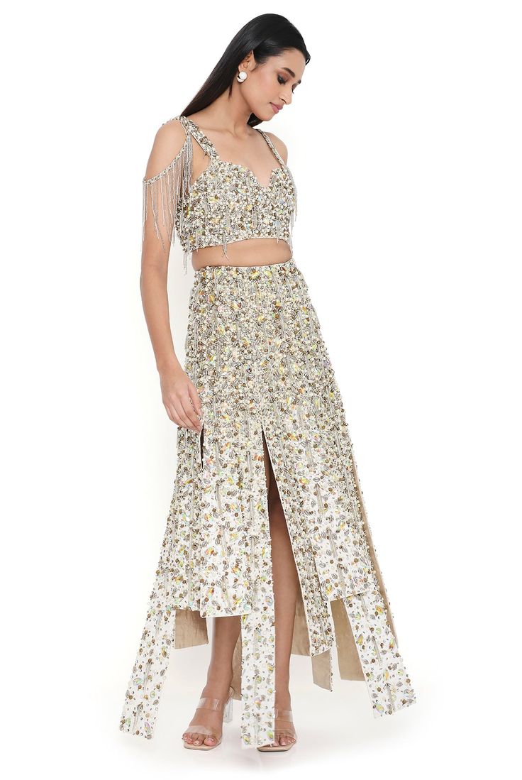 Off-white georgette embroidered choli with high low skirt. Disclaimer: Since we are a made-to-measure brand and our dyeing process and embroidery are handcrafted, there may be slight variations in the color and embroidery of the actual product. The print placement may also vary from what is represented in the images shown on the product page. Elegant Embellished Summer Lehenga, Elegant Embellished Lehenga For Summer, Embellished Georgette Skirt For Reception, Summer Reception Embellished Lehenga, Summer Embroidered Georgette Lehenga, Summer Bollywood Embellished Lehenga, Summer Bollywood-style Embellished Lehenga, Bollywood Style Embellished Summer Lehenga, Summer Embroidered Georgette Choli