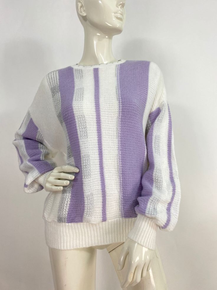 "80s sweater, vintage acrylic sweater, 1980s sweater Measurements:  Shoulder 17\"-18\"/sleeve 22\"/bust (pit-pit)23\"/length 23\"/bottom width 13\"-22\" Mannequin measurements:  5'8\", bust 34\", waist 25\", hip 33\" Please note that vintage clothing sizes can vary greatly.  The Measurements provided  are approximate and are taken lying flat.  I suggest taking a similar garment from your wardrobe and measure it while lying flat.  This way you can compare measurements.  All of our pieces are genu White Knitted Acrylic Sweater, Purple Sweater With Ribbed Cuffs For Spring, Oversized White Acrylic Sweater, Oversized Textured Knit Acrylic Sweater, Retro Long Sleeve Acrylic Sweater, Long Sleeve Acrylic Sweater With Ribbed Cuffs, Retro Spring Sweater With Ribbed Cuffs, Cozy Acrylic Crew Neck Sweater, Trendy Textured Knit Acrylic Sweater