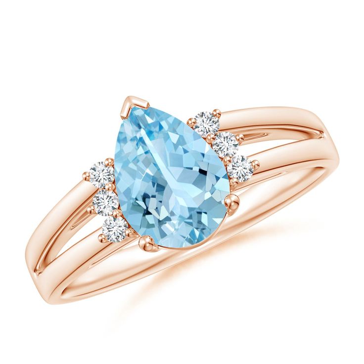 The beautiful pear-shaped aquamarine is secured in a V prong setting on the lustrous split shank ring. For added elegance, a set of three round diamonds adorns both sides of the sea blue gemstone. This pear-shaped aquamarine ring is crafted in 14k rose gold. 19th Wedding Anniversary, Split Shank Ring, Aquamarine Ring, Blue Gems, Aquamarine Rings, Split Shank, Sea Blue, Blue Gemstones, March Birth Stone