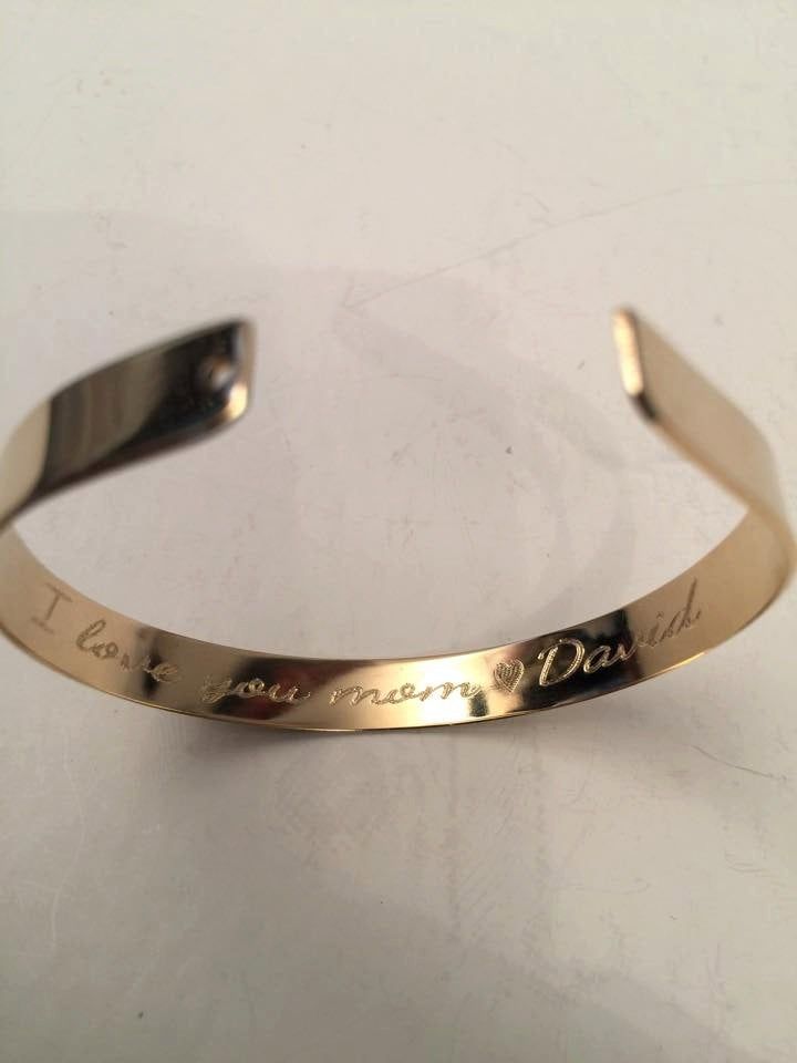 Engraved Gold Bracelet - One piece - Custom cuff bracelet - Double engraving inside and outside Unisex bracelet Convenient, lightweight and flexible on hand . Measurement: bracelet length is 16 cm/6.5 inches and can be adjusted easily for smaller or bigger size. But if you want me to make it shorter/longer pls note it on checkout. You can engrave the entire length sentence outside and inside such as names, date, message or a phrase of your choice- and if you like, include a secret word or love o Engraved Name Bangle Bracelet As Gift, Personalized Round Bracelets For Promise, Personalized Round Bracelet For Promise, Personalized Round Promise Bracelet, Anniversary Nameplate Bracelet With Engraving Option, Personalized Stainless Steel Bangle Name Bracelet, Personalized Stainless Steel Name Bangle, Gold Cuff Bracelet With Engraving Option, Customizable Gold Bangle For Anniversary