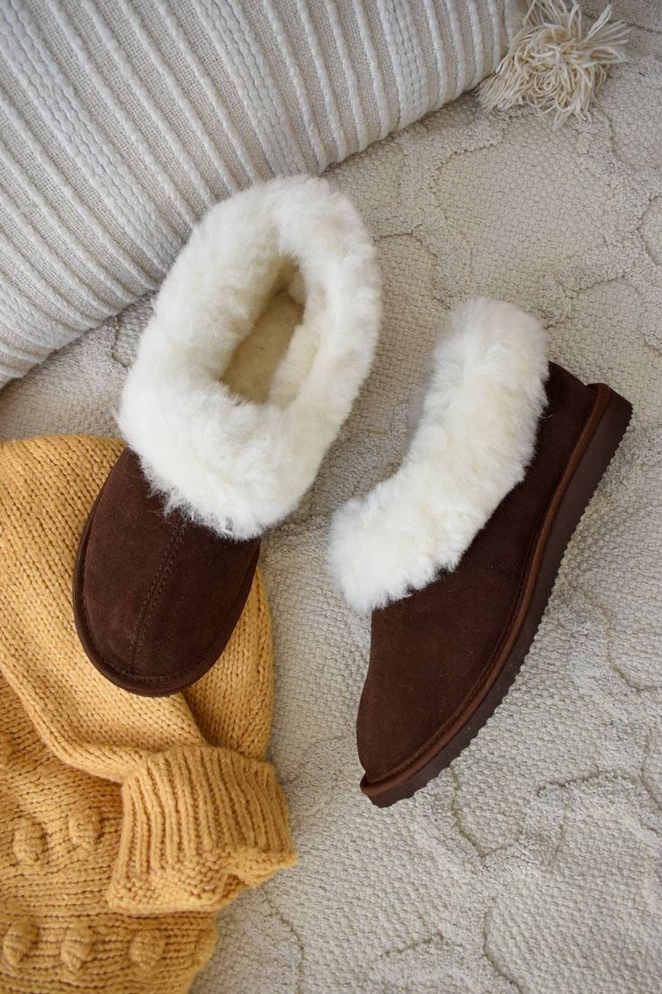 Sheepskin Boots Slippers in dark brown. Outer: suede leather Inside: sheepskin Sole: rubber Leather Slippers With Suede Lining For Fall, Sheepskin Boots With Rubber Sole And Round Toe, Suede Slippers With Plush Lining And Round Toe, Brown Shearling Boots With Rubber Sole, Brown Slip-on Winter Slippers, Brown Winter Slip-on Slippers, Brown Shearling Boots With Suede Lining, Brown Sheepskin Slippers With Rubber Sole, Brown Sheepskin Slippers For Fall