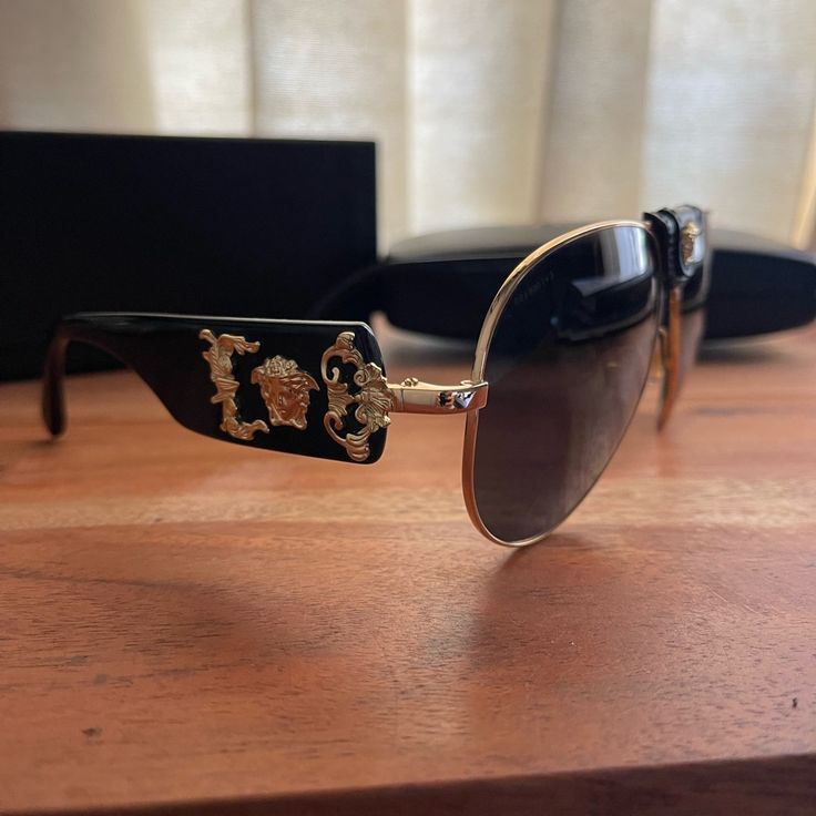 These Are The Most Epic Versace Frames. I’ve Been Holding On To Them Because I Feel Like They’re Such A Special Collectible From The House Of Versace But Deciding To Part Ways For The Right Price. Purchased At Saks. Nwot Original Box And Case Included. Perfect Condition. The Center Leather Piece With Medusa Head Is Removable. Elegant Gold Aviator Sunglasses With Uva Protection, Elegant Shield Sunglasses With Gradient Lenses For Formal Occasions, Elegant Gold Aviator Sunglasses For Party, Designer Gold Shield Sunglasses For Formal Occasions, Luxury Aviator Sunglasses With Mirrored Lenses, Luxury Shield Sunglasses With Gradient Glass Lenses, Luxury Shield Sunglasses With Gradient Lenses, Luxury Aviator Sunglasses With Uv Protection, Luxury Shield Sunglasses With Polarized Glass Lenses