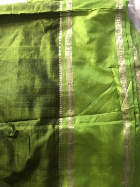 New Pure Silk Saree Material is very lightweight fine soft silk Beautiful Lime green colour with shaded green colour and vibrant green border  Slim zari border Fall is done Any questions please ask No returns Thank you for viewing Green Art Silk Traditional Wear With Cutdana, Green Tussar Silk Traditional Wear, Green Tussar Silk Traditional Wear With Cutdana, Green Paithani Silk Traditional Wear For Festivals, Green Silk Traditional Wear For Festive Season, Festive Green Silk Traditional Wear, Green Silk Blouse Piece With Cutdana, Green Art Silk Blouse Piece For Diwali, Festive Green Silk Dupatta