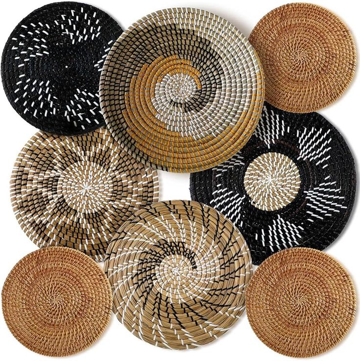 several woven baskets with different designs on them