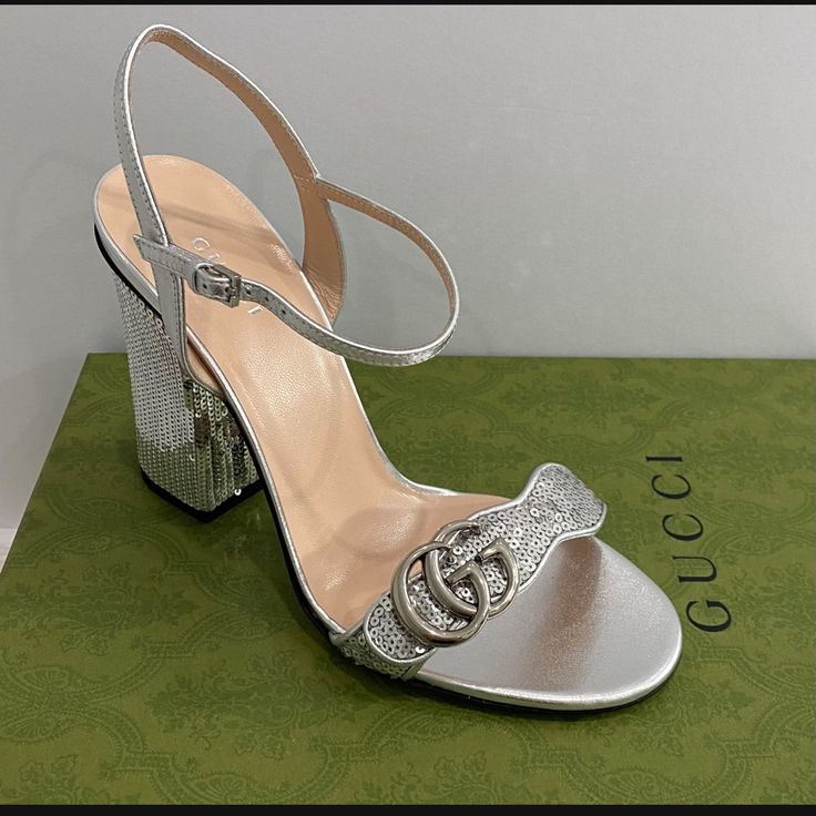 Authentic New/Never Used Gucci Sandal Size: 38 Color: Silver Includes All Original Package (Dust Bag And Box) Gucci Silver Evening Heels, Gucci Silver Designer Heels, Gucci Silver Heels For Evening, Silver Gucci Heels For Evening, Designer Silver Gucci Heels, Silver Designer Gucci Heels, Gucci Luxury Block Heel Heels, Gucci Luxury Block Heel Shoes, Luxury Gucci Block Heels