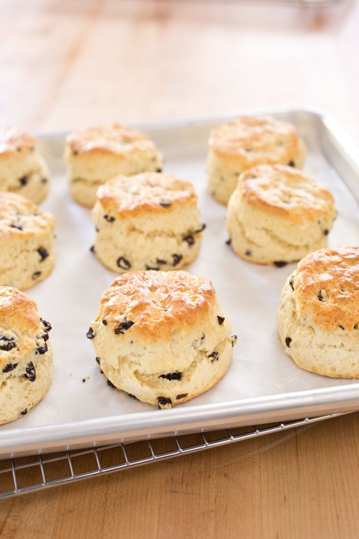 twelve biscuits on a baking sheet ready to be baked